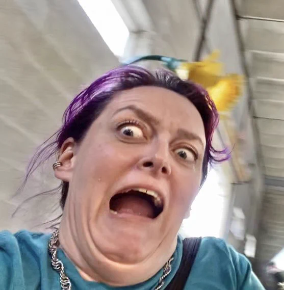 Me on the Teacups ride making exaggerated terror faces
