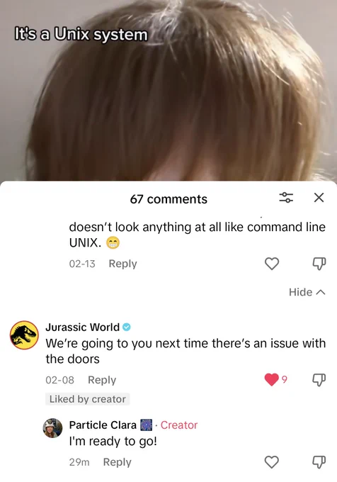 A screenshot from TikTok. The caption in the video says: "it's a UNIX system". The post from the Jurassic Park account says: "we're going to you next time there's an issue with the doors", so I replied, "I'm ready to go!"