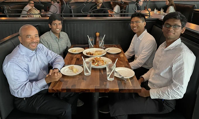Dean Raheem Beyah discussed the winning idea from the 2023 Student Innovation Competition - Promoting Equity and Access over lunch with GT VizTools team members, clockwise, Siva Appana, Ian Kwuan, and Jathin Gadiparthi.