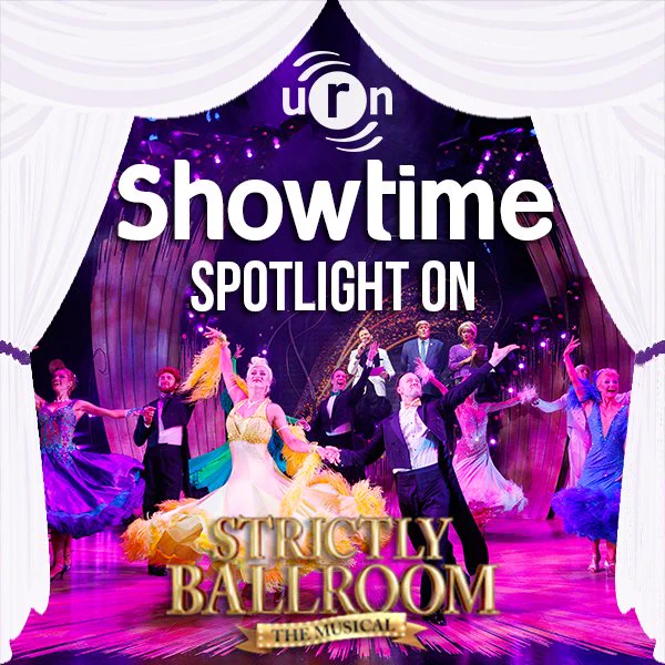 URN Showtime - Spotlight On... Strictly Ballroom: The Musical

White theatre curtains frame a picture of the cast of Strictly Ballroom. It shows Kevin Clifton (as Scott Hastings) in a black tailcoat dancing with  Agnes Pure (Liz) who wears a yellow dress.

Photo credit: Ellie Kurtt