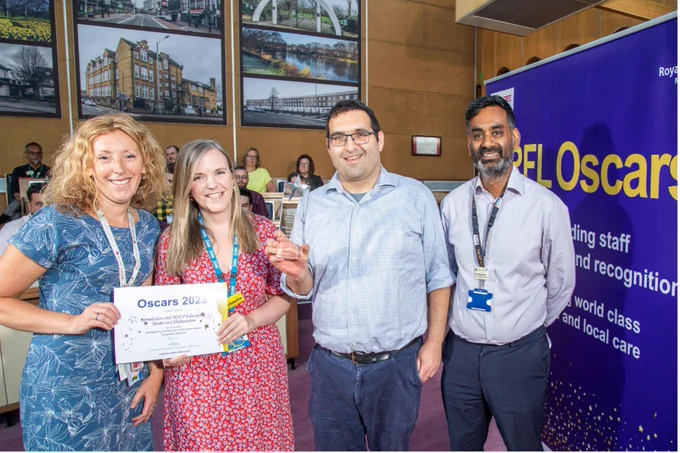 Simulation and health services for the elderly education teams with their award.