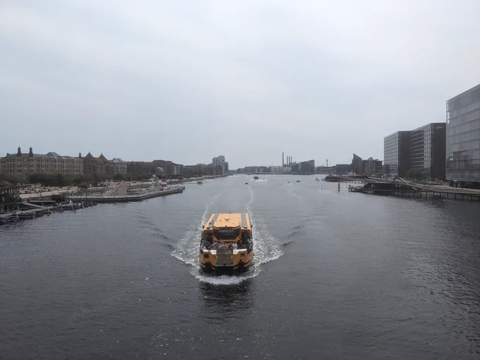 View of the Copenhagen Canal close to Islands Brygge with a water bus in focus