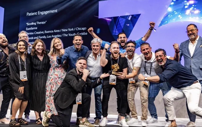 Dentsu Creative teams from Argentina, Brazil and the U.S. that developed the "Scrolling Therapy" app receiving Cannes Lions honors.