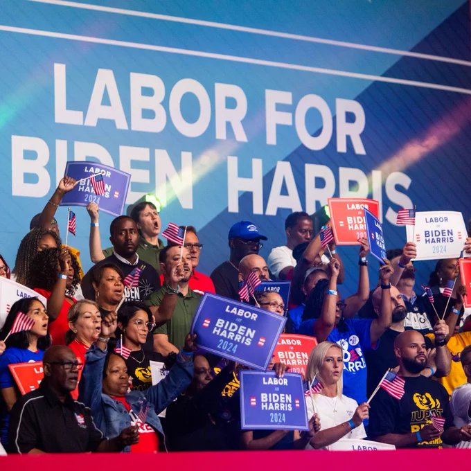 A crowd cheers at a Labor for Biden-Harris 2024 event.