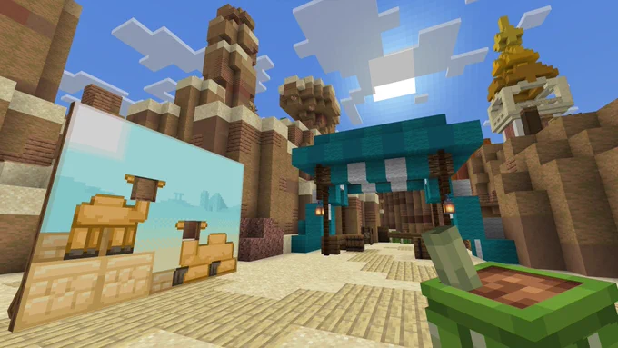 Minecraft screenshot: In a desert canyon setting, a camel photo cutout board sits to the left, while a teal canopy stands to the right.