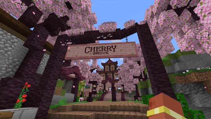 Minecraft screenshot: A large “Cherry Grove” sign opens up to a cherry grove area with a cherry wood building at the center.