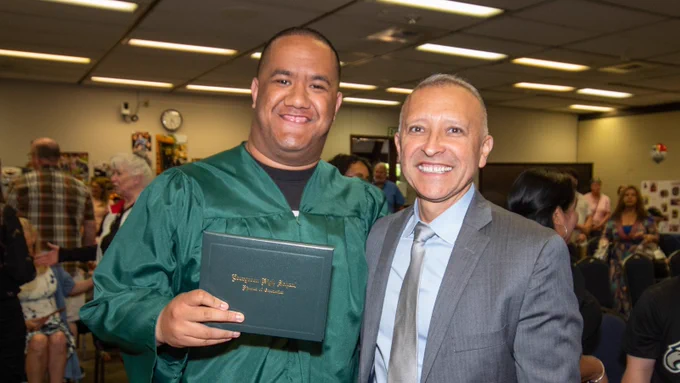 Graduate and superintendent