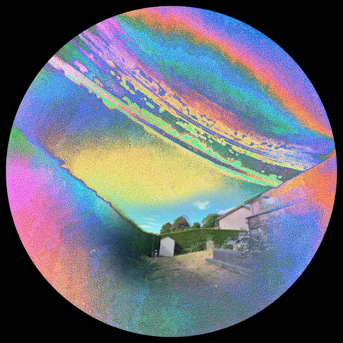 Circular image of a 2 month exposure taken with a Solarcan Puck, colourised in Snapseed and full colour photo overlaid. Puck was facing South-West from mid-April until today.