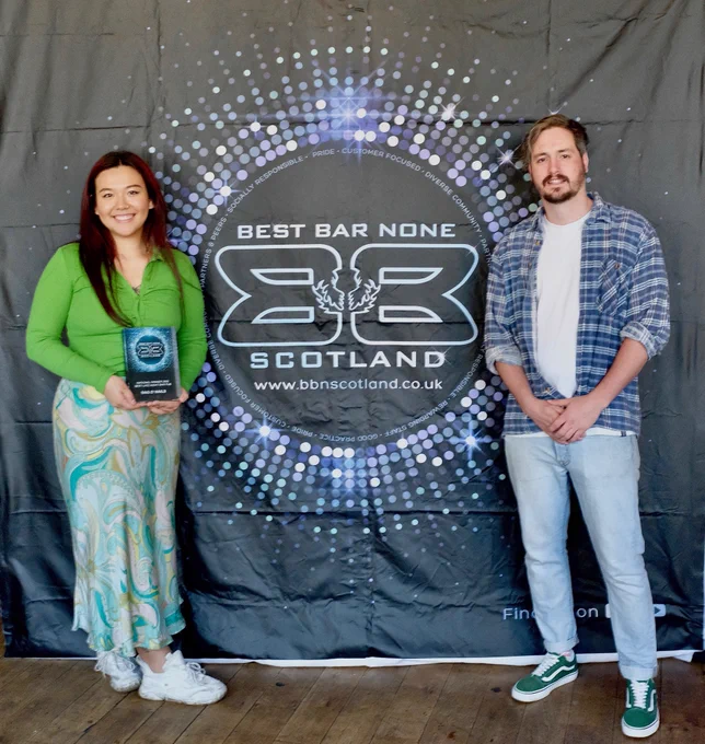 Ling Fraser, manager of Bag O' Nails, with the Glasgow venue's award.
