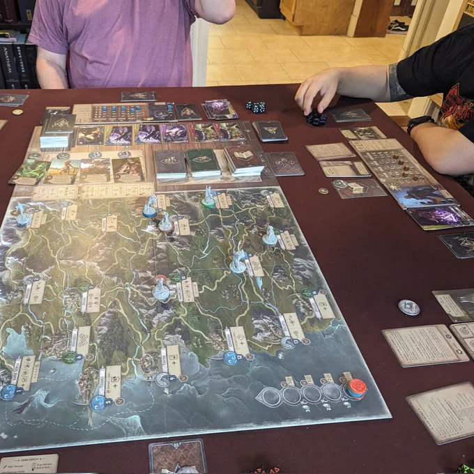 A four player setup of The Witcher: Old World mid play