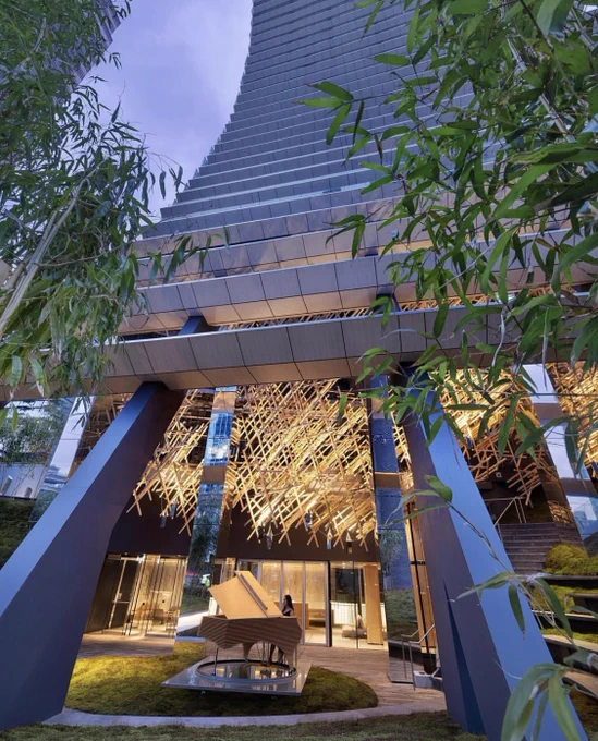 Exterior of Alberni by Kengo Kuma showcasing the Layering Fazioli piano and Kigumi sculpture.