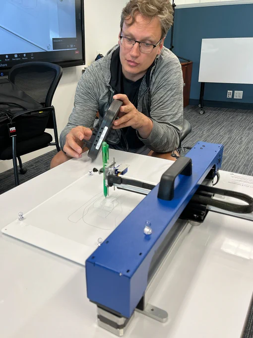 A member of CanAssist demonstrates the Accessible Art Interface.