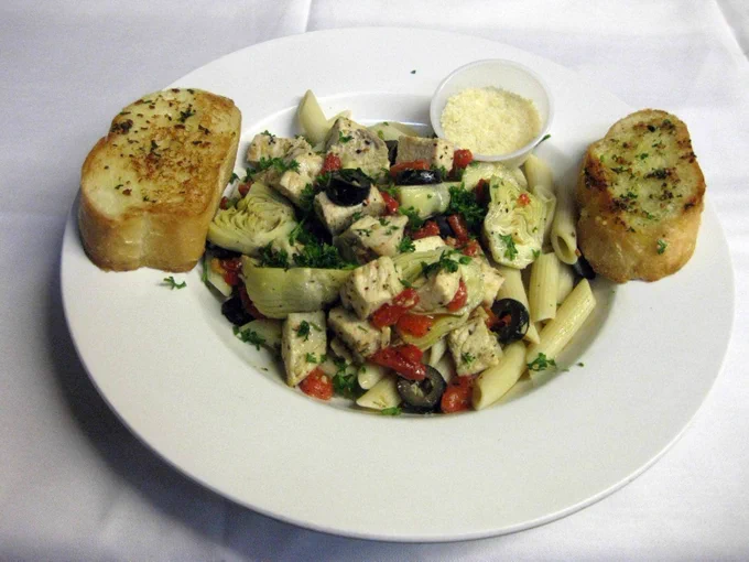 The Bottom Line's Mediterranean Past Special, filled with chicken, sun-dried tomatoes, artichokes, accompanied by a healthy dose of garlic bread. 