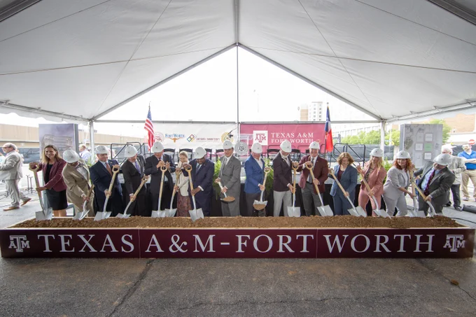 Individuals digging shovels into a container at the Texas A&M Fort Worth Law and Education Building groundbreaking.