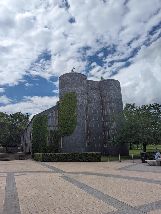 Keele Chapel, an imposing blue-grey 1960s building, that looks a bit like a castle, covered in ivy. 