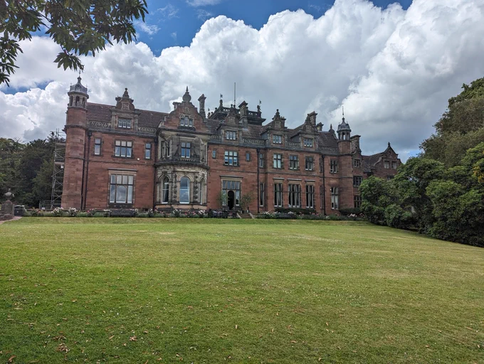Keele Hall - large red brick stately home, with sweeping green lawns