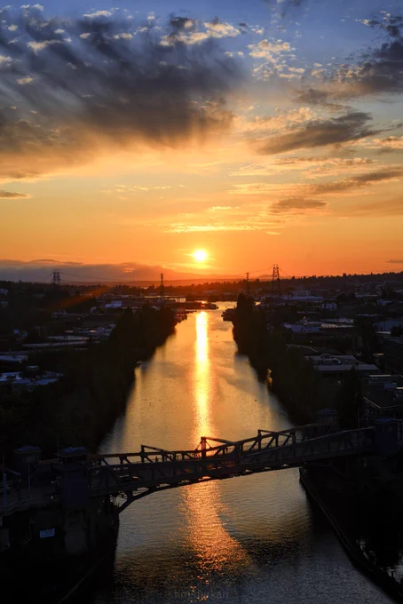 A stunning photo of the sun setting over Fremont canal in Seattle