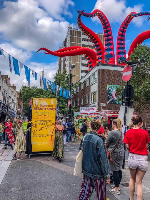 People on Whitecross Street infront of a giant art installation
