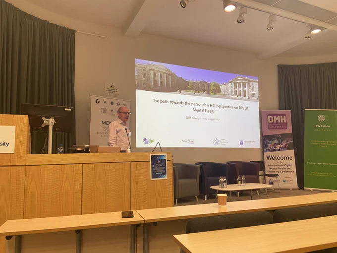 A photo of Gavin Doherty, delivering a keynote on 'The path towards the personal: a HCI perspective on Digital Mental Health'.