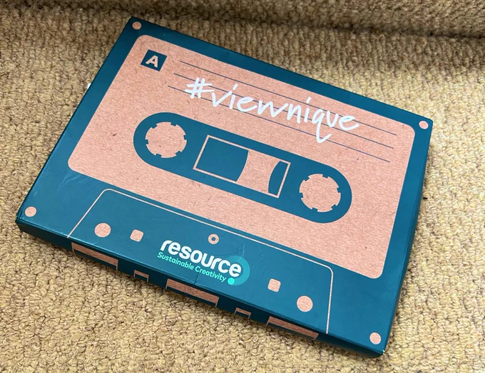 A parcel delivered by Resource. The box is shaped like an old cassette with #ViewNique written on it.