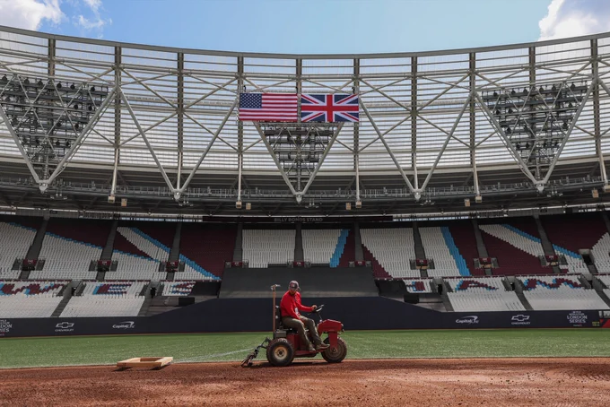An American flag and UK flag hang in London Stadium as the field is prepped.