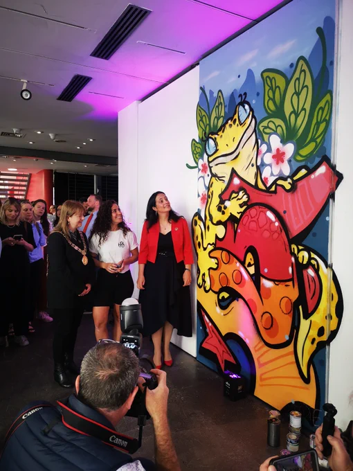 Lord Mayor of Dublin Caroline Conroy and Miniter Catherine Martin standing beside a mural at opening of Space to Create project.