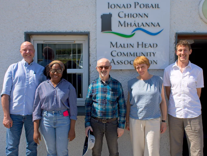 Luke Smith, Dorcas Mikindani, Peter Deeney (all University College Cork), Nicola Baxter (University College Cork), and Kevin Campbell (local resident) outside Ionad Pobail Chionn Mhálanna, where the recent X-ROTOR public dialogue took place