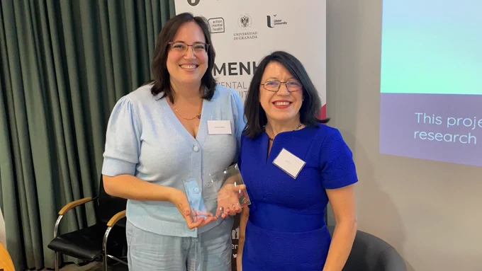 A photo of Zoraida Callejas accepting a keynote award from Edel Ennis.