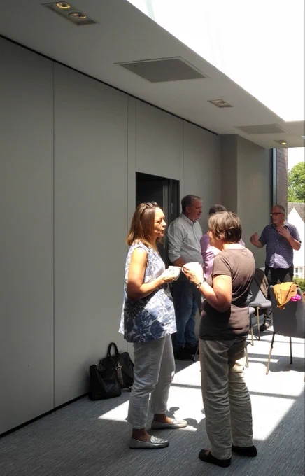 Participants at the CREES 60th anniversary event socialise during a break in proceedings