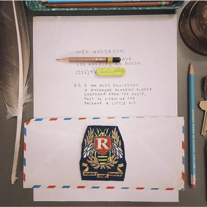 A Rushmore patch sits atop the letter. It reads, PS I am also enclosing a Rushmore Academy blazer insignia from the movie, just to liven up the package a little bit.