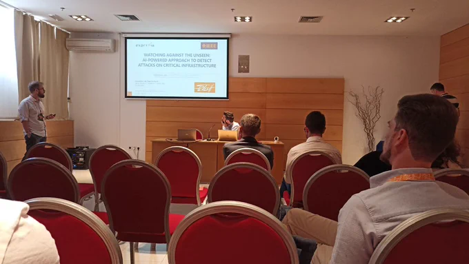 Domenico Lofù presenting the paper: "Watching against the Unseen: AI-powered Approach to Detect Attacks on Critical Infrastructure".