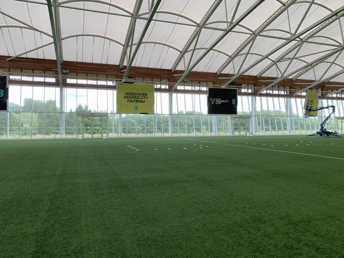 FA Disability Cup branding being put in place on the indoor 3G pitch