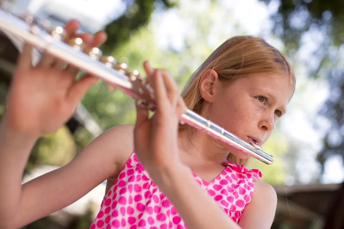 A student playing the flute.