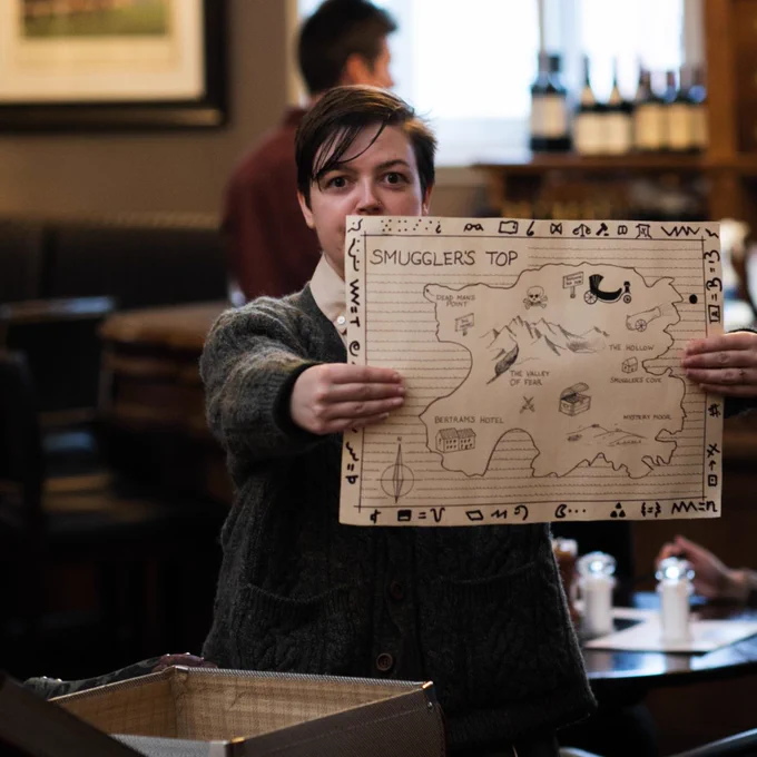 Person holding a drawing