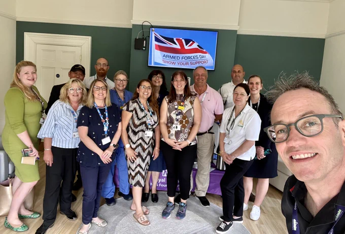 A group photo showing Op Courage mental health practitioners meeting members of the Forces Staff Network at Royal Berkshire Hospital.
