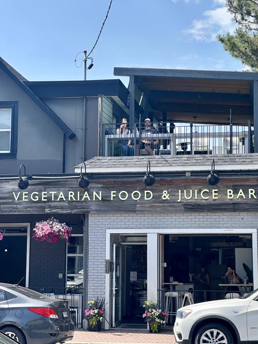 Image of Pure Kitchen & Juice Bar's storefront with a rooftop patio.