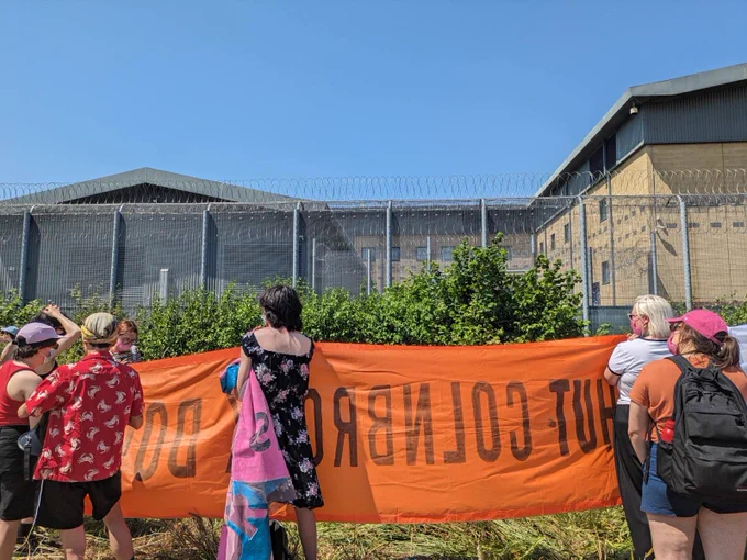 banner in front of colnbrook detention centre