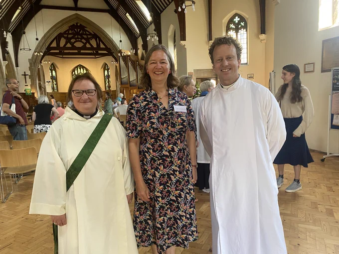 Rev Sarah, Fleur and Rev Brutus standing together at the back of the church after the service