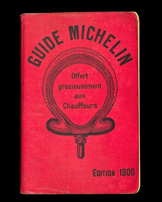 The first Michelin guide, published in 1900. Translation of cover reads: Michelin Guide, offered free of charge to drivers