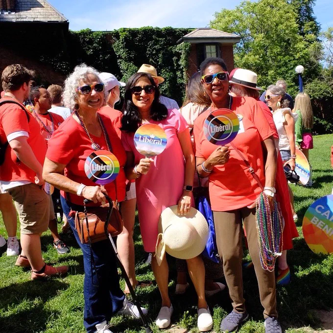 Minister Anand pictured with two women at Toronto Pride.