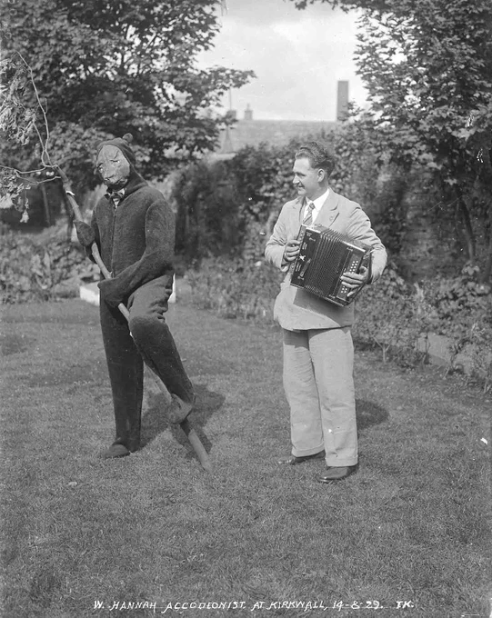 A black and white photograph of accordionist Will Hannah and someone dressed as a bear, taken in 1929