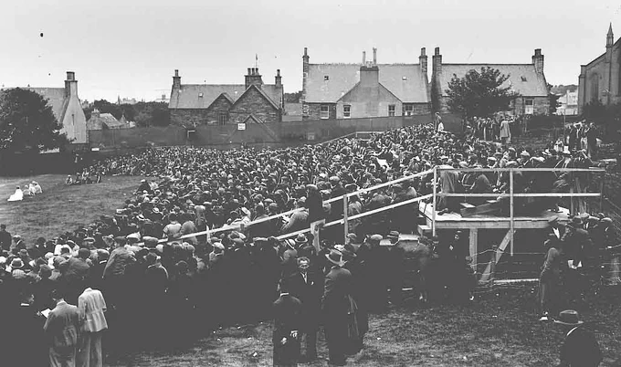 A black and white photograph of the St Magnus Pageant in Kirkwall