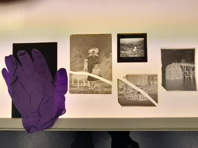 Purple rubber gloves plus damaged images displayed on a light-up table