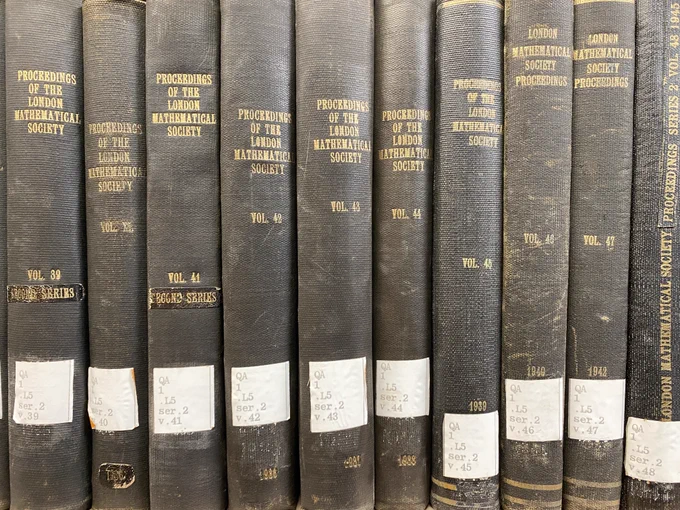 Photo of spines of ten volumes of the Proceedings of the London Mathematical Society (from the 1930s & 1940s) on a shelf in Bizzell Memorial Library at the University of Oklahoma 