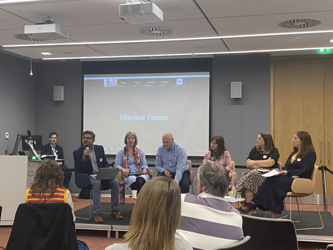 Panel members on the stage (six people)