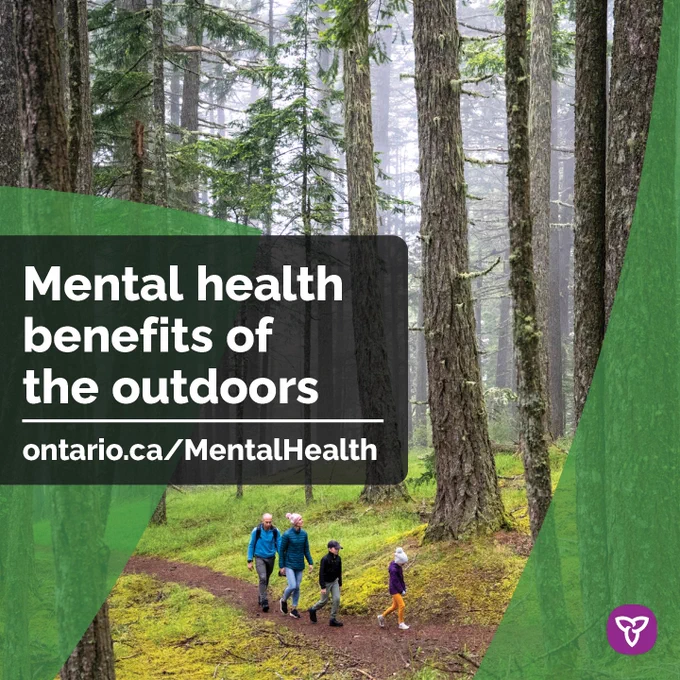 Family hiking in the woods. Text reads: Mental health benefits of the outdoors. ontario.ca/MentalHealth