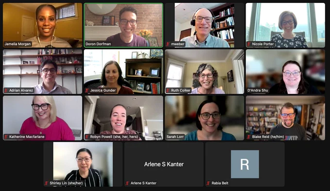 A zoom meeting room with 17 smiling faces of different genders and races
