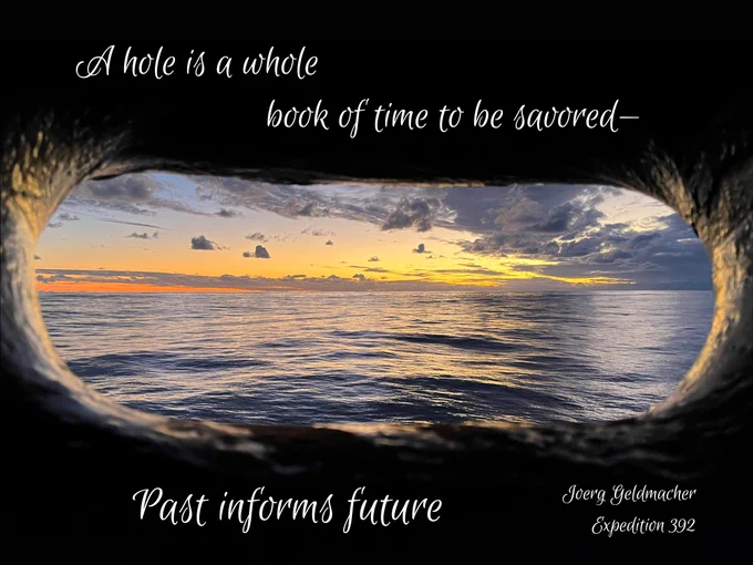 An image of the ocean at sunset silhouetted through the dark hawsehole. Text overwritten on the image says "A hole is a whole / book of time to be savored— / Past informs present / Joerg Geldmacher Expedition 392"