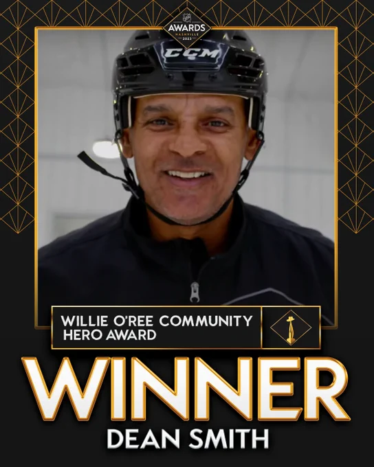 Top: 2023 NHL Awards logo
Middle: photo of Dean Smith
Below the photo in white text on a black rectangle with a gold outline, Willie O'Ree Community Hero Award.  with a cutout of the trophy beside.
At the bottom in large white text, "Winner, Dean Smith"