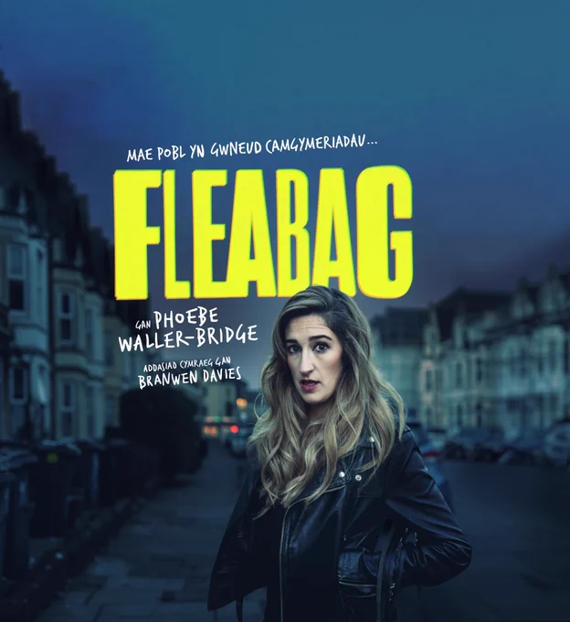 An image of Leah Gaffey in a leather jacket with a street behind her. Text: "Mae pobl yn gwenud camgymeriadau. Fleabag. gan Phoebe Waller - Bridge. Addasiad Cymraeg gan Branwen Davies"